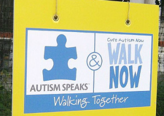 Sign that reads: Autism Speaks and Cure Autism Now Walking Together